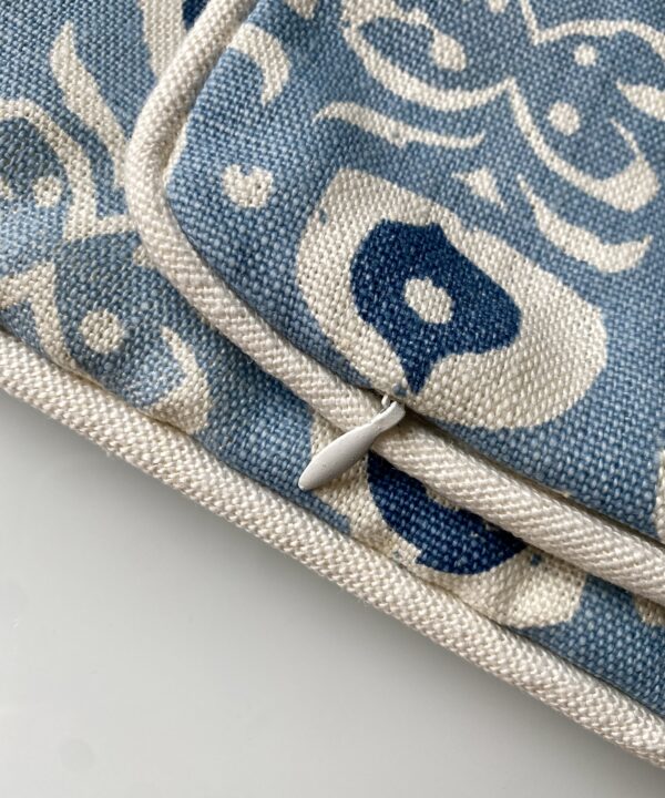 Discreet zip and piping detail on a bespoke, hand-print linen cushion cover.