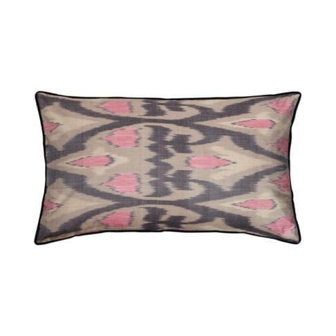 A rectangular pink and warm, grey, silk ikat cushion with black accents.