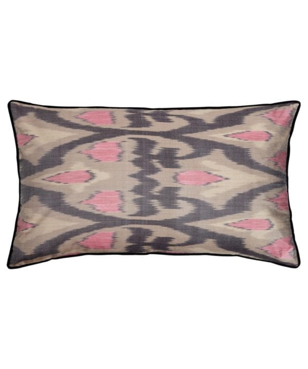 A rectangular pink and warm, grey, silk ikat cushion with black accents.