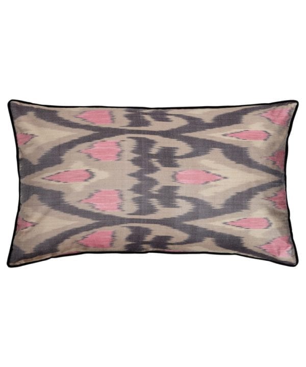 A rectangular pink and warm, grey, silk ikat cushion with black accents.