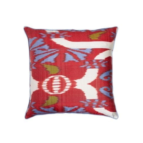 A red silk cushion in an Ikat design with blue and green accents measuring 50 x 50cm.