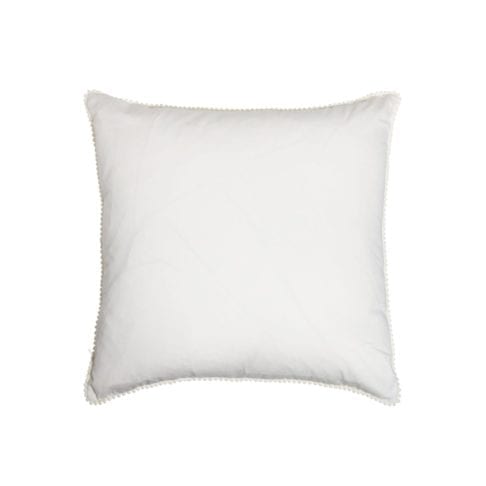 The white cotton back of the square ikat cushions with ivory miniature bobble trim.