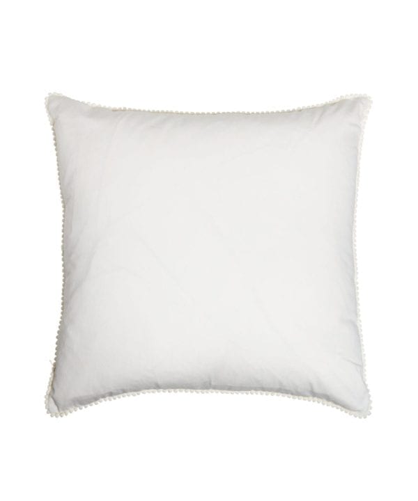 The white cotton back of the square ikat cushions with ivory miniature bobble trim.