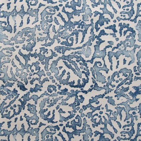 A close up of the Majolica, Italian-inspired, blue patterned wallpaper in Indigo with a pale, off-white ground.