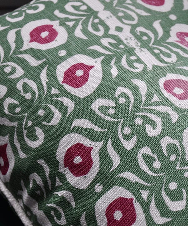 Detail of a green and red hand-print linen cushion with an Iznik design.