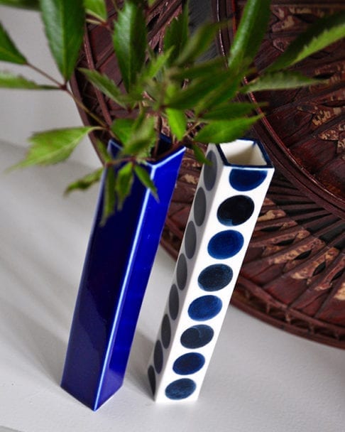 Two hand-painted Japanese bud vases in plain and polka dot Royal blue ceramic.