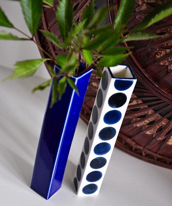 Two hand-painted Japanese bud vases in plain and polka dot Royal blue ceramic.