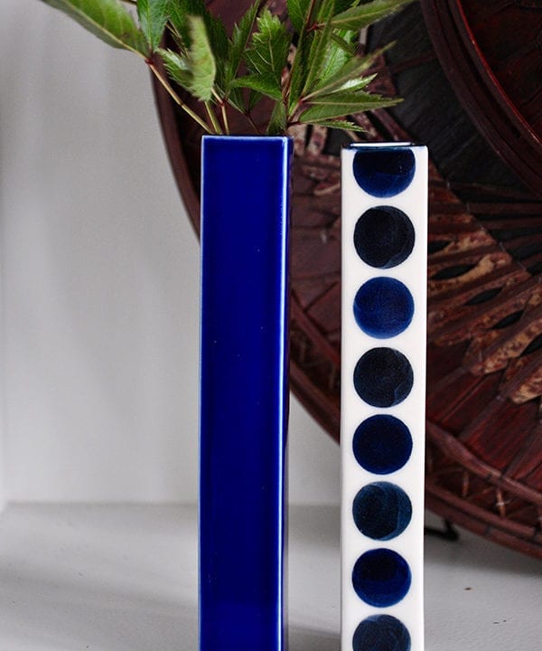 Japanese blue bud vases with polka dot and plain decoration.