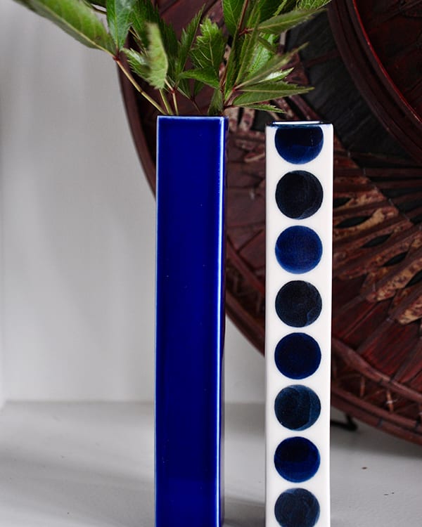 Japanese blue bud vases with polka dot and plain decoration.