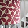 Close-up shot of a red, hand-printed linen lampshade in 'Maroc'.