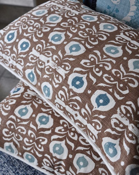 Brown, hand-print linen cushions in an Iznik design.