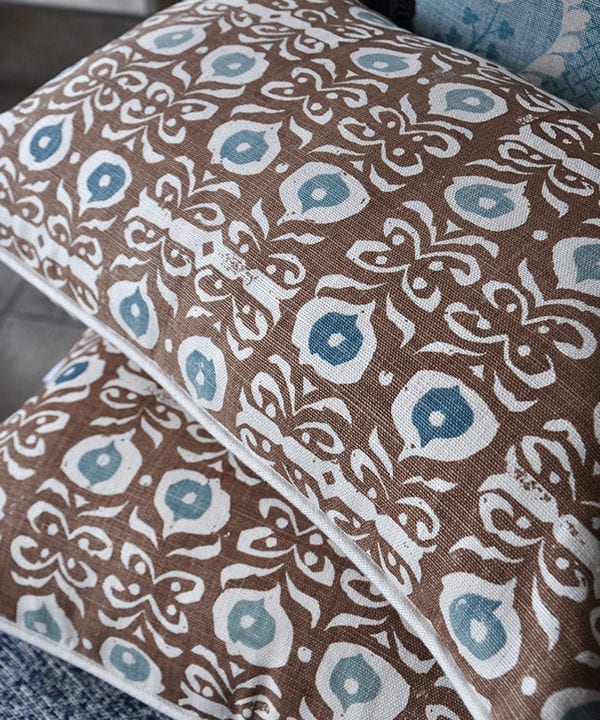 Brown, hand-print linen cushions in an Iznik design.