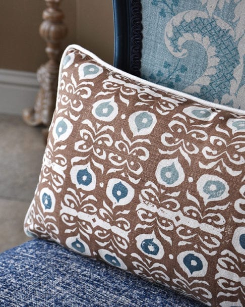 A brown hand-print linen cushion in an Iznik design.