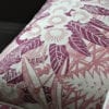 A close-up shot of Webb's Wonder printed linen pink floral cushion in the raspberry colourway from Telescope Style.