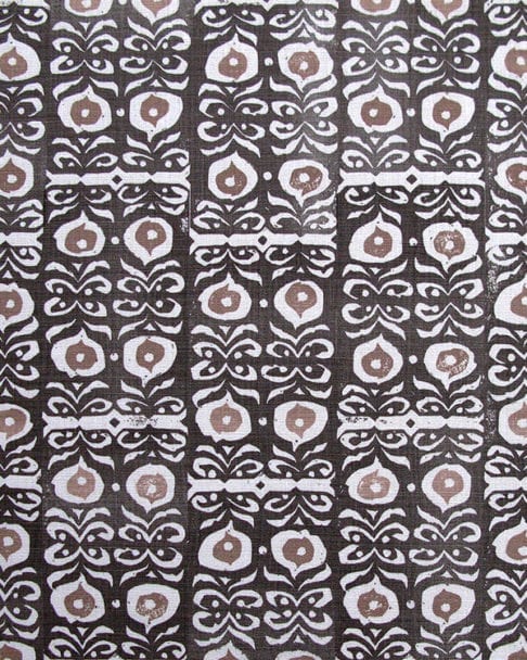 Iznik handprinted linen in inky-black kohl and taupe patterned cushion fabric close-up..