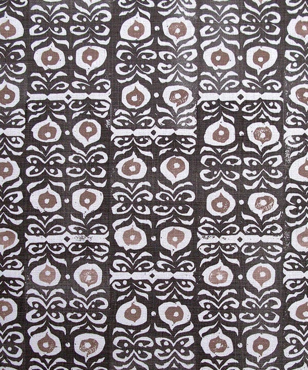 Iznik handprinted linen in inky-black kohl and taupe patterned cushion fabric close-up..