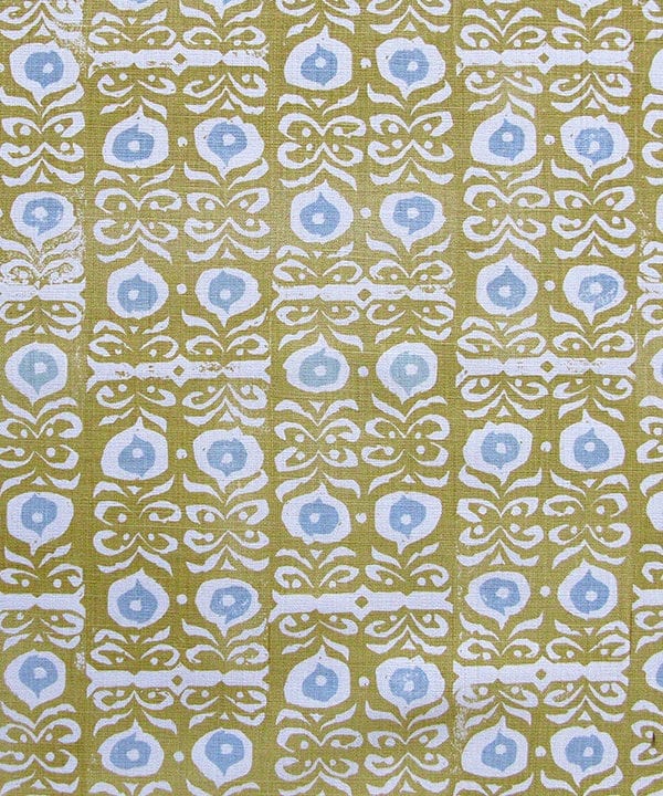 A close-up fabric shot of Iznik yellow patterned cushions in the Old Gold colourway available from Telescope Style.