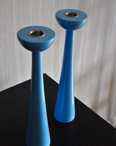 Glossy coloured candlesticks with a simple, modern silhouette.