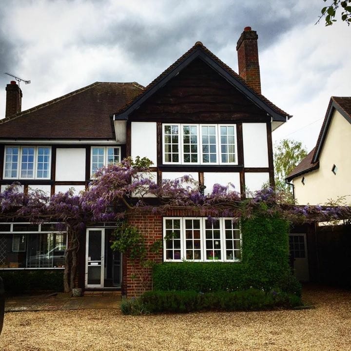 An original, wisteria-clad, 1930s house with 1970/80s additions.