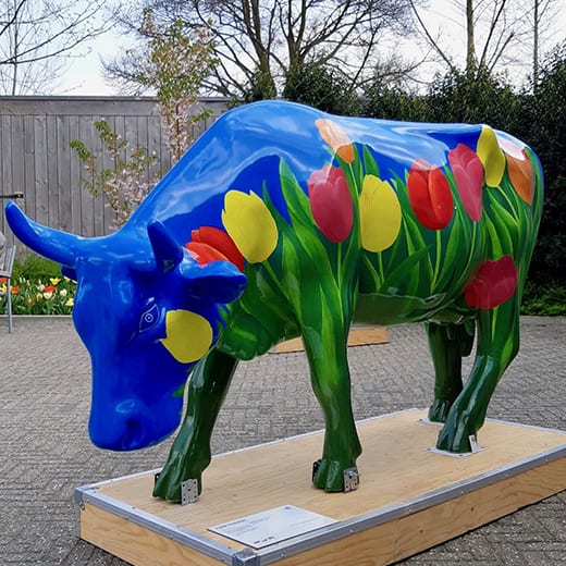 A tulip-painted cow sculpture at the Keukenhof in Holland.