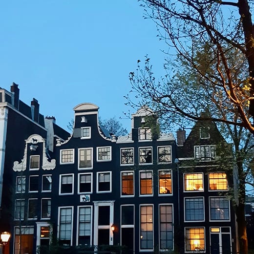 Amsterdam canal houses at dusk from the Telescoe Style blog, Holland in Springtime.