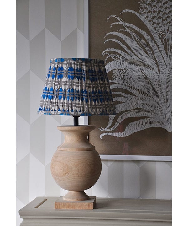 Putty and blue-hued, block print cotton lampshades available in various sizes.