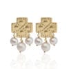 Greek gold plated, cross earrings with freshwater pearl drops inspired by Greek heritage designs from Telescope Style.