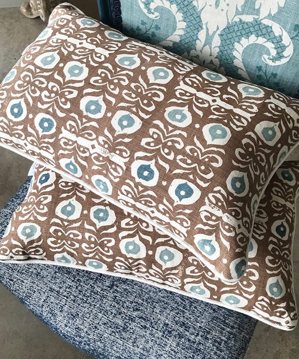 Beautiful Iznik print, brown patterned cushions on linen with soft blue accents.