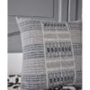 Grey square cushions with hand-woven detailing from Nagaland in India. Available through Telescope Style.