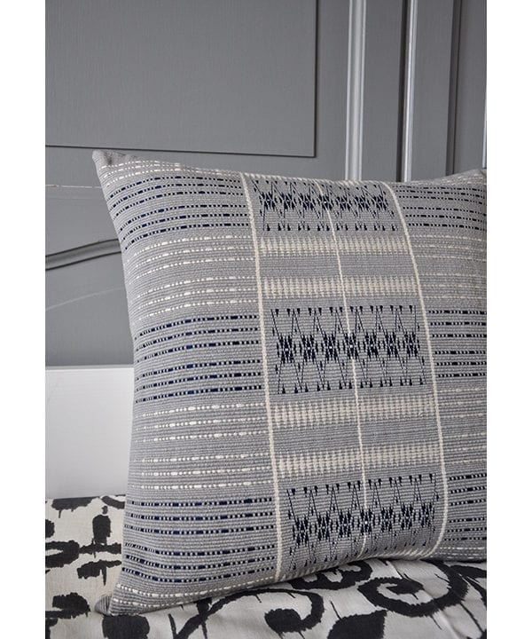 Grey square cushions with hand-woven detailing from Nagaland in India. Available through Telescope Style.