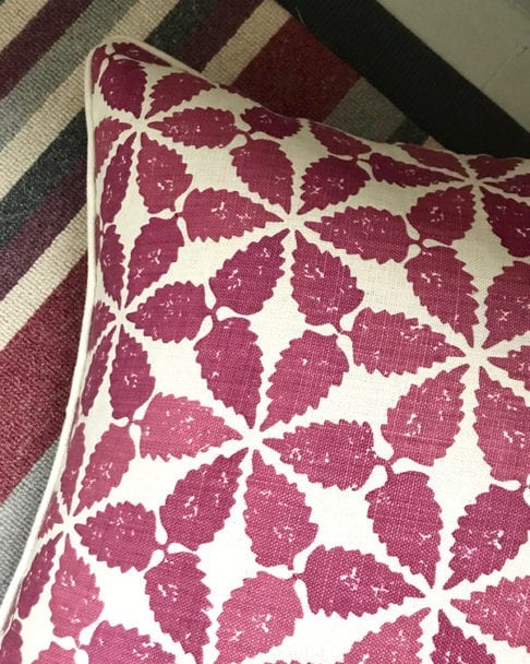 Cranberry red, Moroccan-patterned cushion detail.