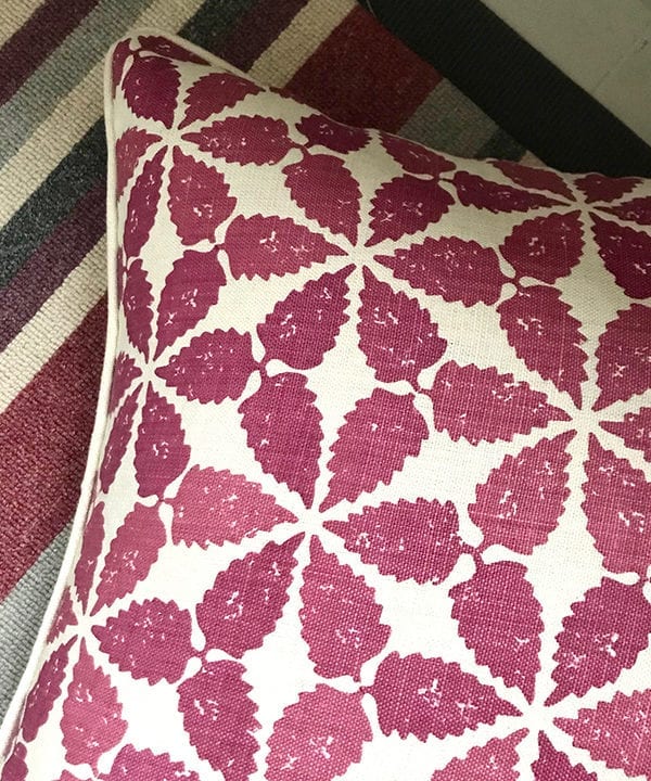 Cranberry red, Moroccan-patterned cushion detail.