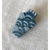Porcelain jewellery brooch depicting Japanese waves, the symbol of tranquillity. Hand-painted in blue and white.