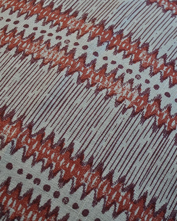 Hand-print linen zig-zag stripe in a brick red.