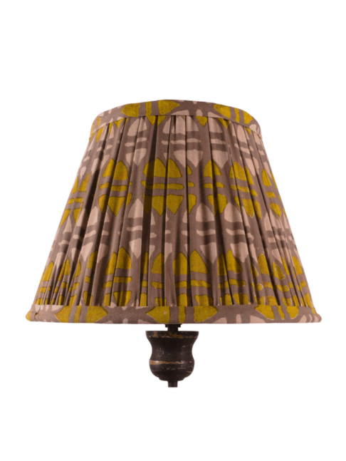 A small, mustard and putty, block-print gathered lampshade.