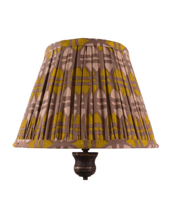 A small, mustard and putty, block-print gathered lampshade.