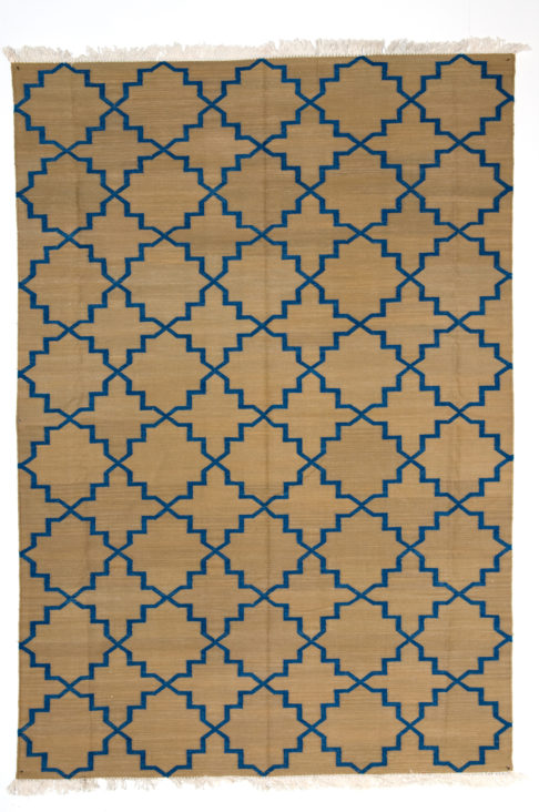 Blue dhurrie rug with pattern inspired by jali-screens, from Telescope Style.