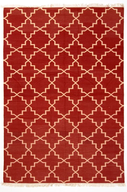 Deep red dhurrie rug with a cream lattice design.