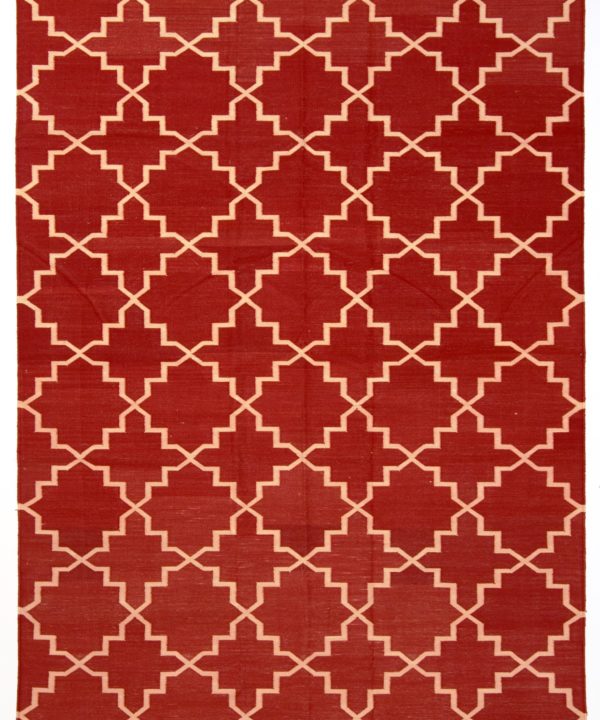 Deep red dhurrie rug with a cream lattice design.