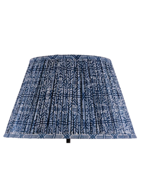 A block-print indigo, gathered-cotton lampshade.