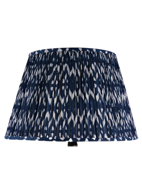 Cut out shot of zig-zag block-print cotton lampshades in indigo.