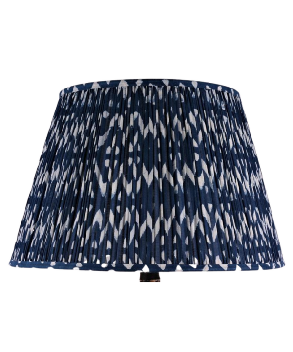 Cut out shot of zig-zag block-print cotton lampshades in indigo.