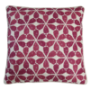 A cranberry red patterned cushion in Moroccan, hand-printed linen.