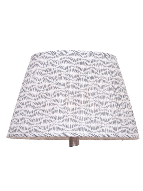 A large, block-print, grey patterned lampshade against a white background.