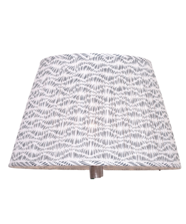 A large, block-print, grey patterned lampshade against a white background.