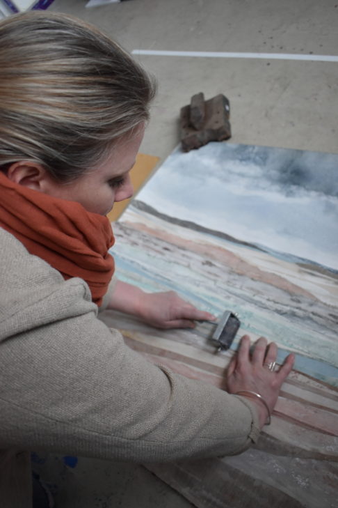 Emma Tweedie working on the original mixed media collage Dunes At Murlough Bay.