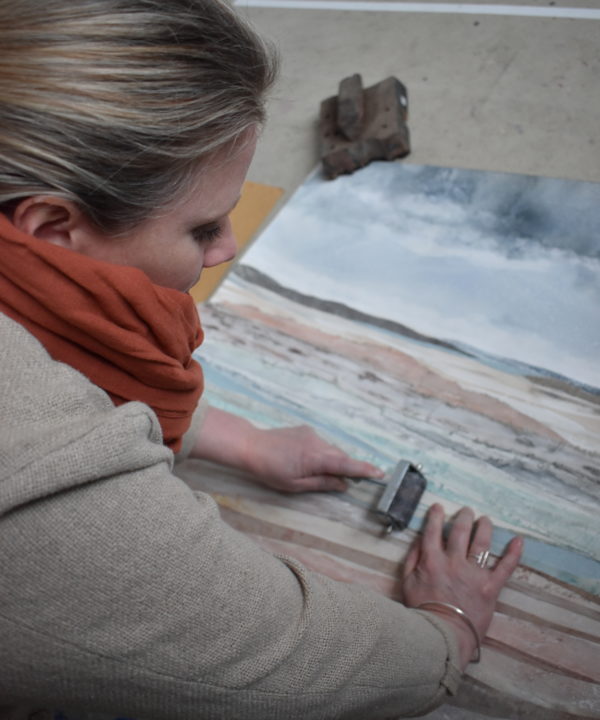 Emma Tweedie working on the original mixed media collage Dunes At Murlough Bay.