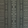 Charcoal grey tablecloth closeup depicting Arabian architectural motifs.