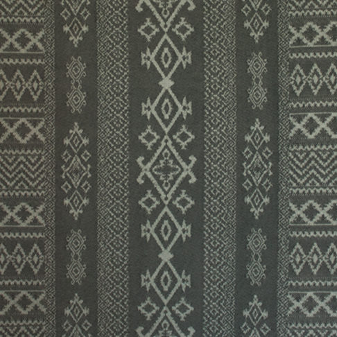 Charcoal grey tablecloth closeup depicting Arabian architectural motifs.