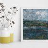 Irish landscapes art by Emma Tweedie, framed and styled next to colourful yellow jars filled with dried meadow flowers.